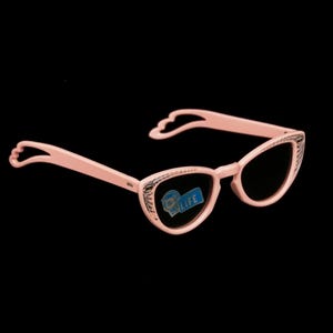 May include: Pink cat-eye sunglasses with a decorative detail around the lenses. The sunglasses have a blue sticker on the right lens that says "New Life".