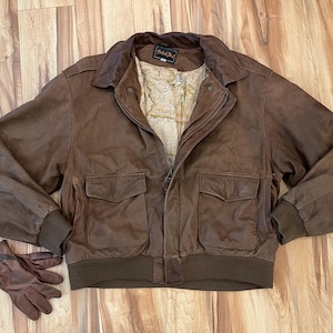 L- Chaqueta bomber de motociclista vintage de los años 80, 100 % piel con forro de mapa / British Mist