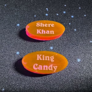 King Candy and Shere Khan random tokens for Disney Villainous Sugar & Spite. The actual color of these tokens are far more pink than orange which is not showing properly in these photos.