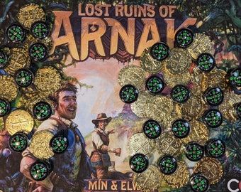 May include: A close-up of a board game called "Lost Ruins of Arnak" with gold coins and compass tokens. The game board features a jungle scene with two adventurers.