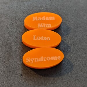 Villain random tokens for Disney Villainous Bigger & Badder: Madam Mim, Lost, and Syndrome.