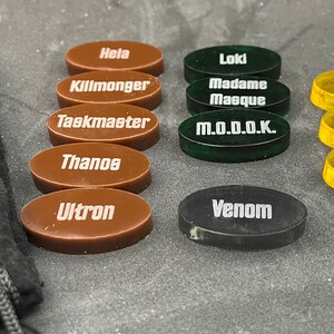 Marvel Villainous 12 random tokens with velvet bag.