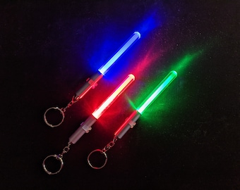 Light Saber LED Keychain for Star Wars Fans: Red, Green, Blue, or White