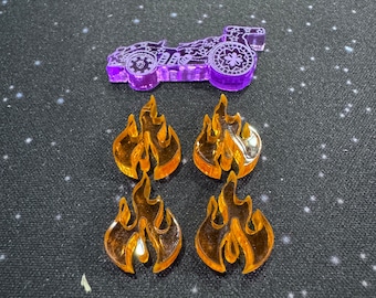 May include: Four orange acrylic flame tokens and a purple acrylic car token. The car token has a detailed design with a wheel and a flower.