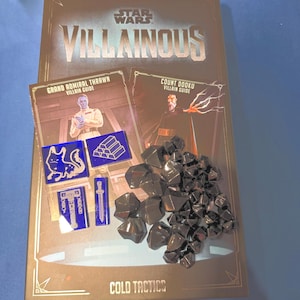 May include: A Star Wars Villainous board game box set. The box features the game title and character guides for Grand Admiral Thrawn and Count Dooku. Includes game pieces and tokens. The game is titled "Cold Tactics".