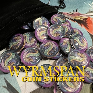 Wyrmspan dragon coins coming out of a black velvet bag. This is the coin sticker set by LaserLand.