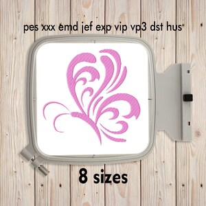 May include: Pink butterfly embroidery design in an embroidery hoop on a wooden background. The design is available in 8 sizes.