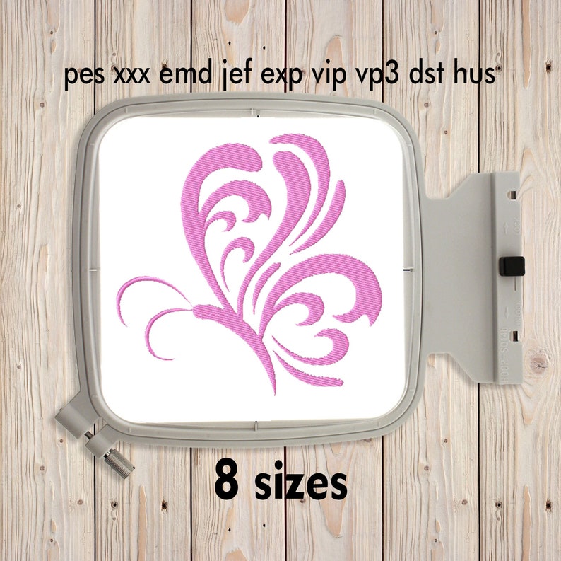 May include: Pink butterfly embroidery design in an embroidery hoop on a wooden background. The design is available in 8 sizes.