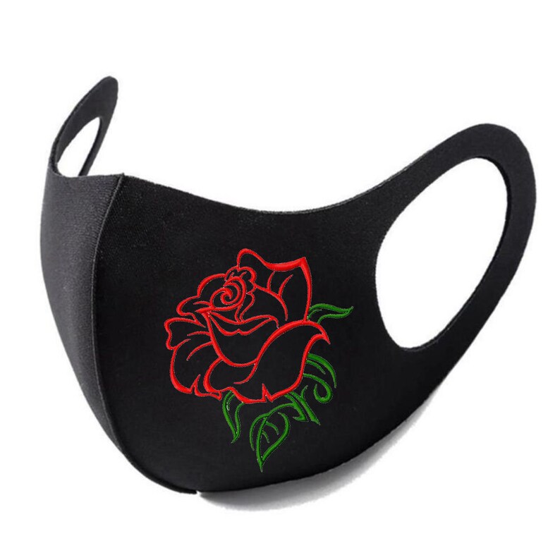 May include: A black face mask featuring an embroidered design of a red rose with green leaves. The mask is constructed from a solid black fabric with integrated ear loops on both sides, providing a contoured shape for coverage over the nose and mouth.