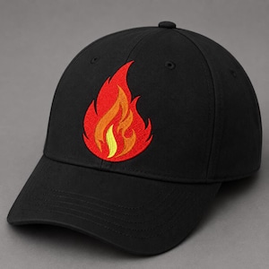 May include: A black baseball cap featuring an embroidered flame design on the front. The flame is stitched in vibrant shades of red, orange, and yellow, creating a bold contrast against the solid black fabric of the cap's crown and brim.