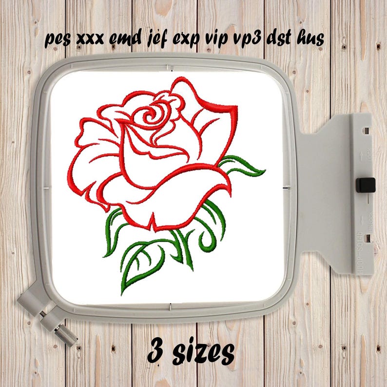 May include: An embroidery hoop containing a machine embroidery design of a red rose with green leaves and stems. The text "pes xxx emd jef exp vip vp3 dst hus" is printed above the hoop, and the text "3 sizes" is printed below the hoop.