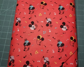 Fabric, Cotton, Disney Mickey and Minnie Music. Sold in 1/2 yard increments.