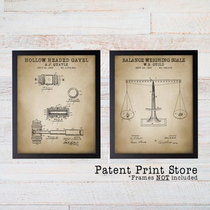 May include: Two vintage patent prints in black frames. The left print shows a drawing of a hollow headed gavel with the text "HOLLOW HEADED GAVEL A.J. QUAYLE JULY 24, 1906 NO. 2,755,833". The right print shows a drawing of a balance weighing scale with the text "BALANCE WEIGHING SCALE W.B. GUILD SEPT. 29, 1885 NO. 286,975". Below the prints is the text "Patent Print Store *Frames NOT included".