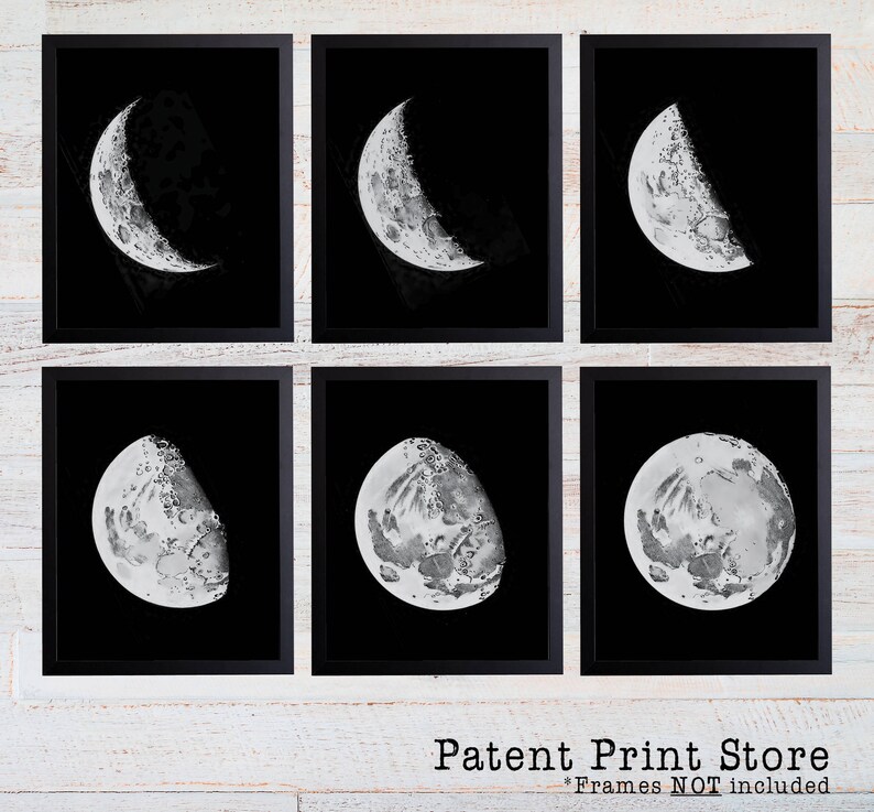 May include: Set of six black framed prints featuring different phases of the moon in grayscale. Each print shows a different crescent moon shape against a black background.