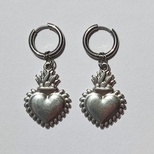 Sacred heart huggie earrings, Florence and the machine earrings, Silver stainless steel charm hoops, Milagro flaming heart earrings