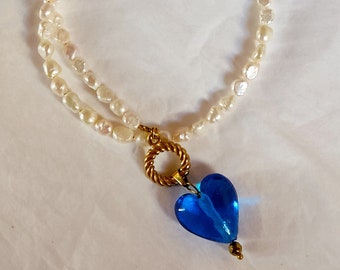 Gold round toggle clasp necklace, Off white freshwater pearl choker, Blue murano glass heart necklace, Romantic charm heart necklace