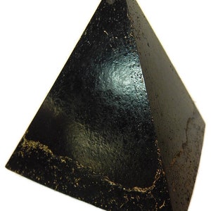 May include: A black pyramid with a textured, glossy surface and visible gold-colored flecks embedded along the base edges. The object features a sharp apex and four triangular sides that meet at the top, displaying a dark, reflective finish.