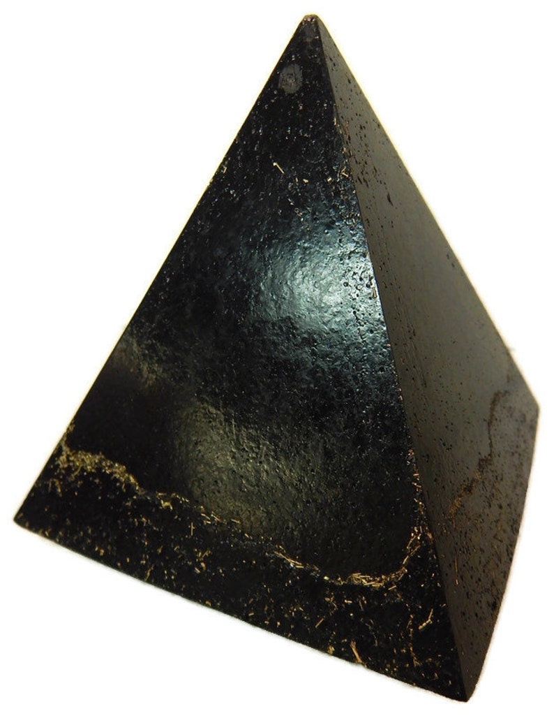 May include: A black pyramid with a textured, glossy surface and visible gold-colored flecks embedded along the base edges. The object features a sharp apex and four triangular sides that meet at the top, displaying a dark, reflective finish.
