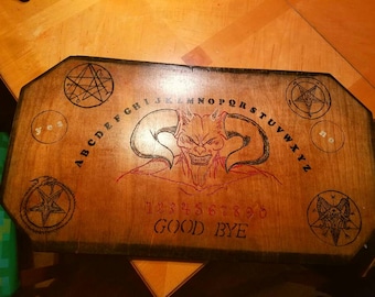 Satanic, demonic Ouija's talking board with skull planchette. Hand crafted and burnt in. One of a kind. Artist signed