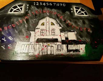 Amityville horror, ouija -spirit board with axe planchette.  New signed by artist , numbered.