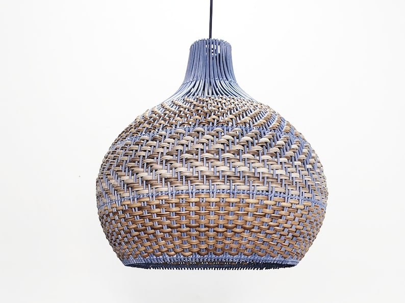 May include: A woven pendant light with a blue and brown pattern. The light is round and has a bulbous shape. The light is made of natural materials and has a rustic look.