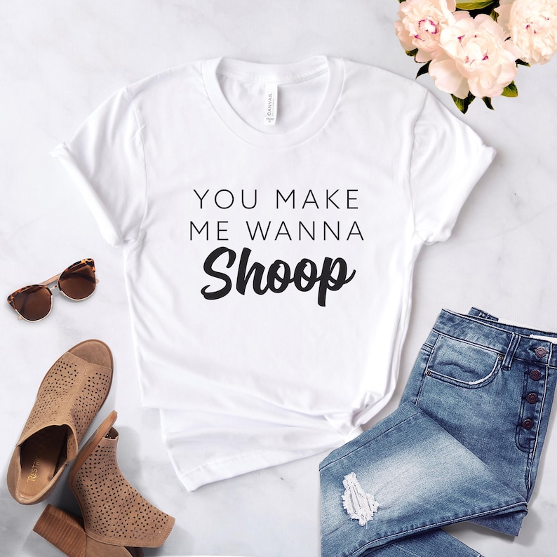 May include: White t-shirt with the text "You make me wanna Shoop" printed in black.