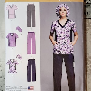 May include: Simplicity sewing pattern 1020 AA. The pattern includes scrubs with a floral print top, solid color pants, and a matching cap. The pattern is designed for sizes 10-18.