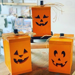 Wooden jack-o-lantern. Halloween pumpkin. Comes with light.