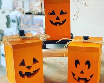 Wooden jack-o-lantern. Halloween pumpkin. Comes with light.