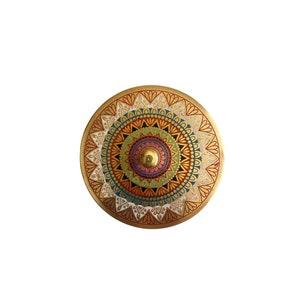 May include: A round, gold-coloured decorative plate with a colourful mandala design. The mandala features intricate patterns in shades of red, orange, yellow, green, blue, and purple.