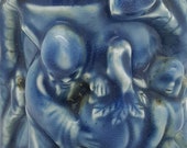 A Chinese Qing Dynasty Blue Glaze Brush Holder with Raised Carving of Longevity
