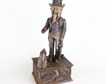 Hucha mecánica antigua de hierro fundido con la figura del Tío Sam, estilo americano de finales del siglo XIX y principios del XX, 27,3 cm (10,75 pulgadas).