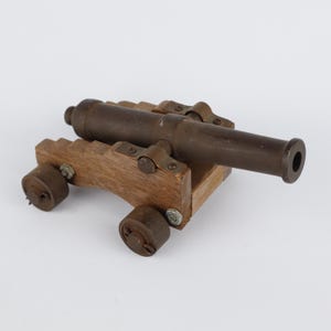 Naval cannon steel barrel on a wooden carriage with steel wheels vintage scale model 6.25 inches long from the 1980s
