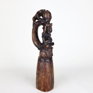 Rare antique Javanese hand-carved ceremonial hardwood pounder with shaman figure 10 inches