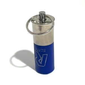 May include: A silver keychain with a blue cap. The cap has the word "ELITE" and a stylized "R" printed on it.