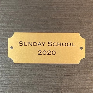 Custom Engraved 2 1/2&quot; x 1&quot; Gold Metal Plate w/ Notched Corners and Screws. Personalized for Memorials, Awards, Title Plates, and more.
