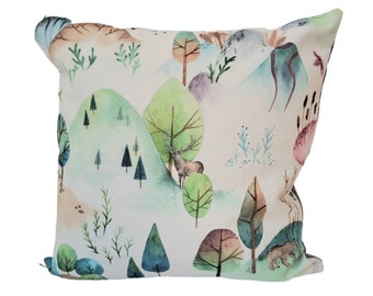 Woodland print cushion in green and blue