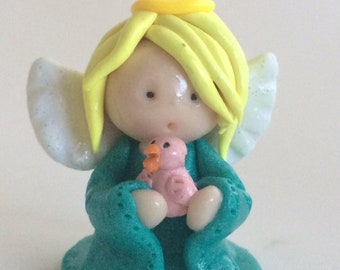 Handmade polymer clay winged angel ornament , my own clay creation.