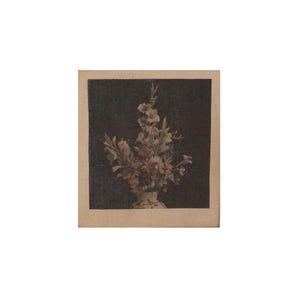 May include: A square print on textured fabric featuring a floral arrangement of gladiolus and other blossoms in a light-colored vase. The flowers are set against a dark, solid background, creating a high-contrast composition within a tan border.