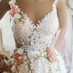 Off white/light ivory wedding dress with roses Inga Ezergale design