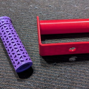 May include: A purple textured grip and a red metal pull-up bar. The bar has a hole in the center for attaching to a weight.