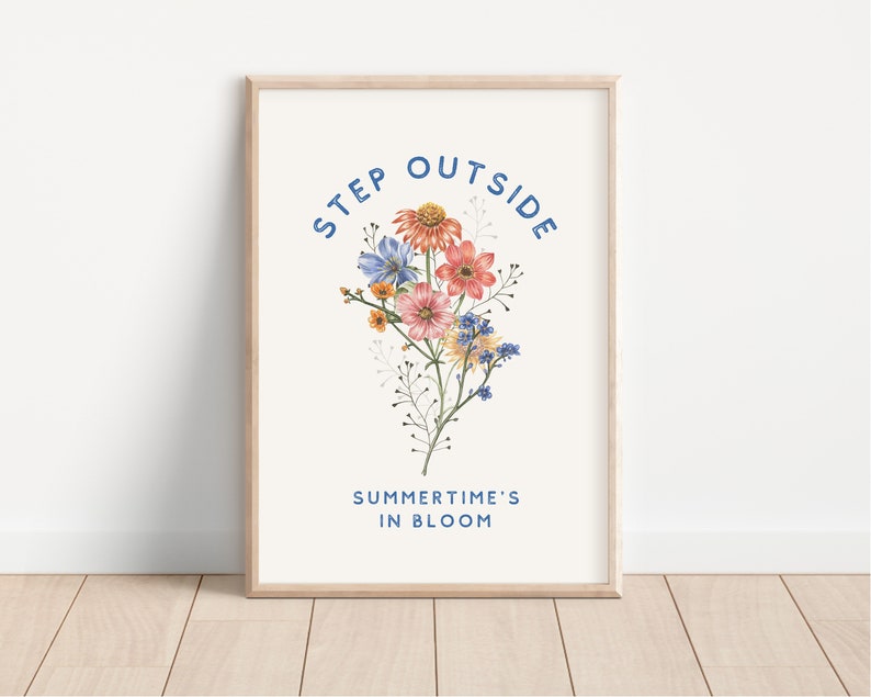 May include: A white framed print with a floral illustration and the text "STEP OUTSIDE SUMMER TIME'S IN BLOOM" in blue.