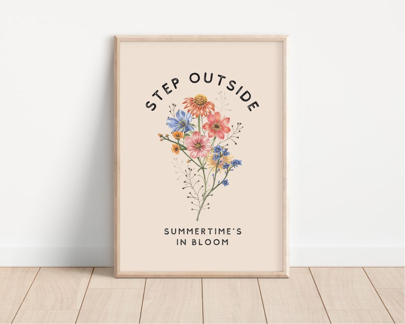 May include: A beige poster with the text "STEP OUTSIDE" in a black circular font. The text "SUMMER TIME'S IN BLOOM" is below the circle. A bouquet of pink, blue, and yellow flowers is in the center of the circle.
