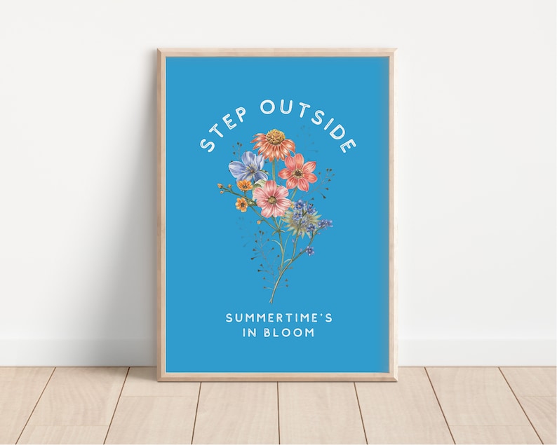 May include: A blue poster with the text "STEP OUTSIDE SUMMER TIME'S IN BLOOM" in white. A bouquet of pink, blue, and yellow flowers is in the center of the poster.
