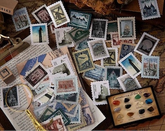May include: A collection of vintage postage stamps featuring various international landmarks and scenes, scattered alongside a magnifying glass, a printed document with text, and a small display card labeled Gemstones of the World.