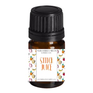 May include: A small amber glass bottle with a black lid and a white label. The label has a colorful fruit pattern and the text "Main Street Melts Candle Co. Stitch Juice www.MainStreetMeltsCandleCo.com".