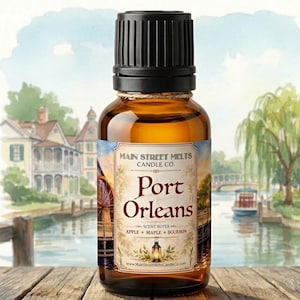 May include: A small amber glass bottle with a black ribbed cap. The label features the text Main Street Melts Candle Co. Port Orleans, with scent notes of apple, maple, and bourbon, and a watercolor illustration of a waterfront scene.