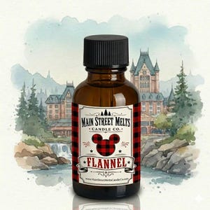 May include: A small amber glass bottle with a black screw cap, featuring a white label with red and black buffalo plaid borders. The label displays the text Main Street Melts Candle Co. and Flannel, with a mouse-ear silhouette in plaid.