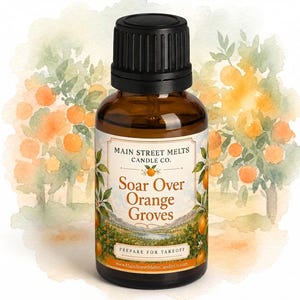 May include: A brown glass bottle with a black cap featuring a label that reads Main Street Melts Candle Co. Soar Over Orange Groves. The label displays a watercolor illustration of an orange grove with trees and fruit against a white background.