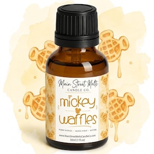 May include: A 30ml (1 fl. oz) amber glass bottle with a black cap, featuring a label that reads Main Street Melts Candle Co. mickey waffles, warm waffles, maple syrup, butter, and www.MainStreetMeltsCandleCo.com, set against a yellow watercolor background.